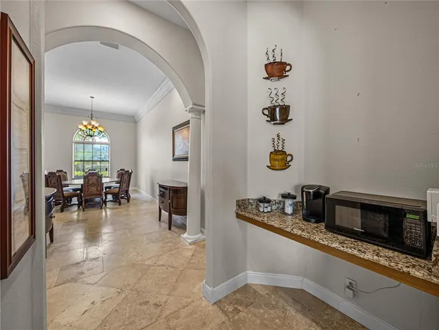 a view of a room with wooden floor and furniture