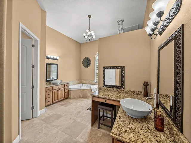 a utility room with sink dryer and washer