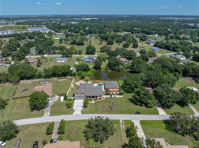 an aerial view of a house with a garden