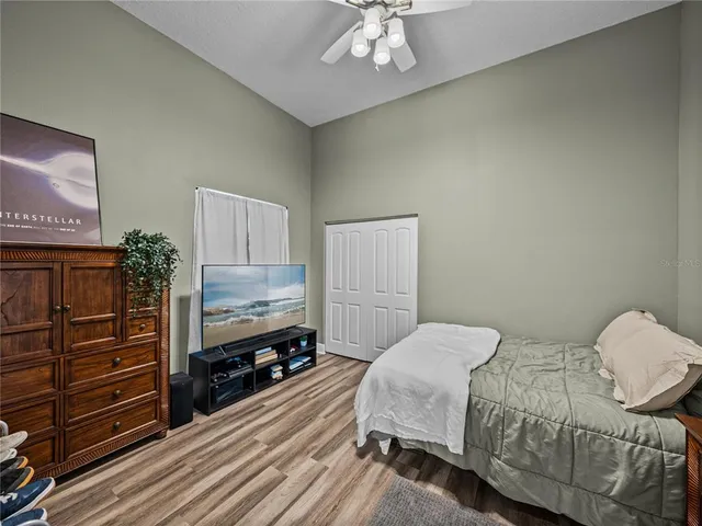 a view of a house with backyard porch and sitting area
