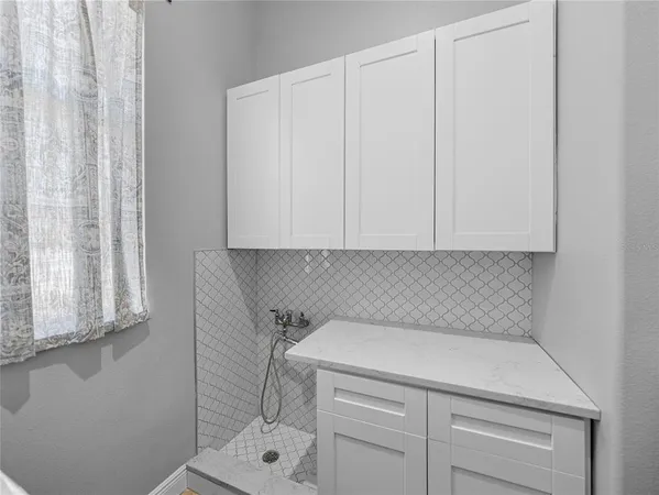 a kitchen with stainless steel appliances granite countertop a stove and a refrigerator