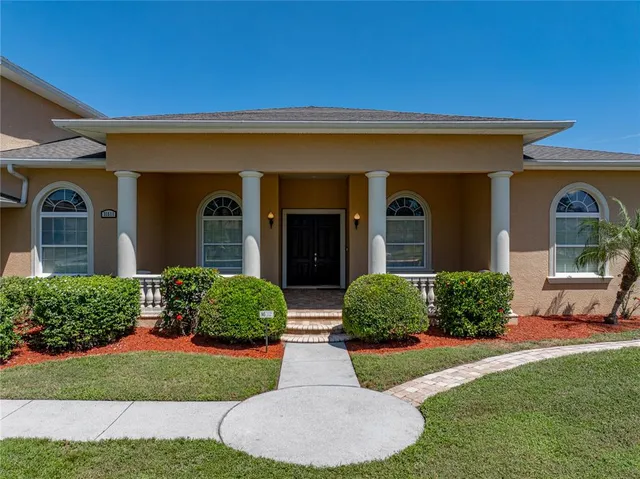a front view of a house with a yard