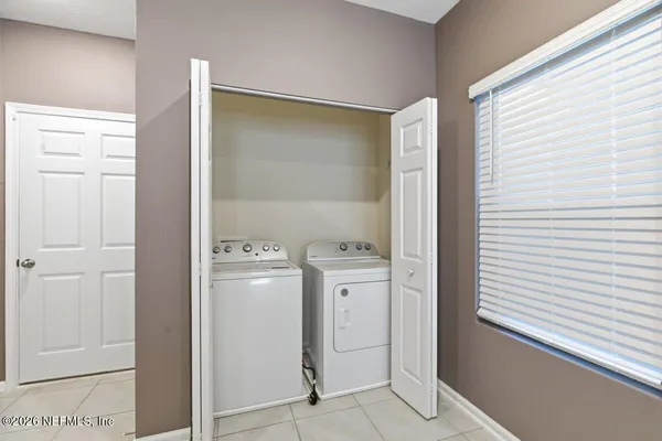 a view of kitchen with center island and stainless steel appliances