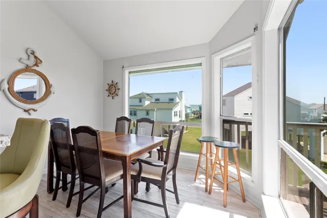 a dining room with furniture and window