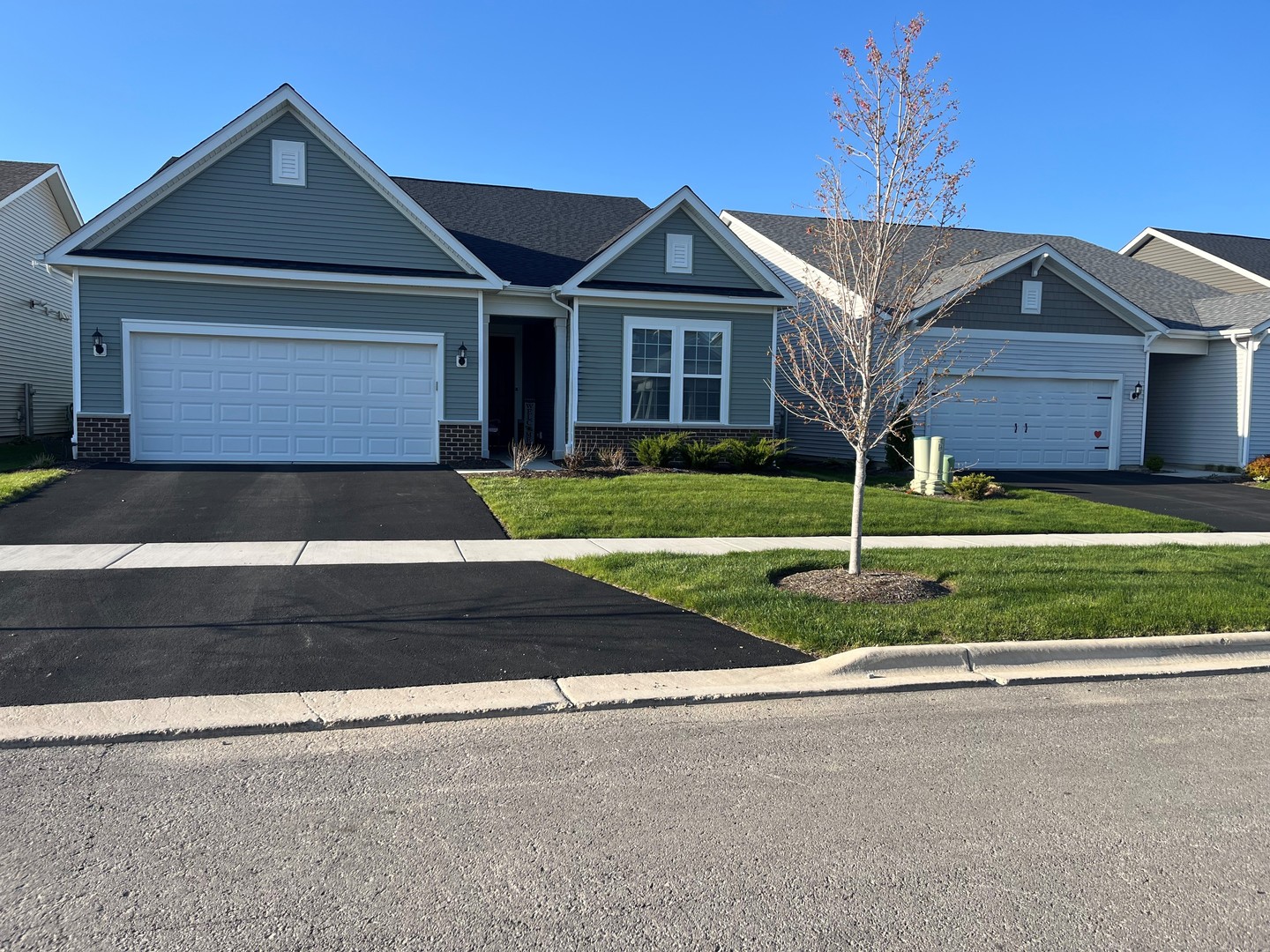 3274 Mirehaven Court Aurora, IL 60503 - Photo 1 of 11 a front view of a house with a yard