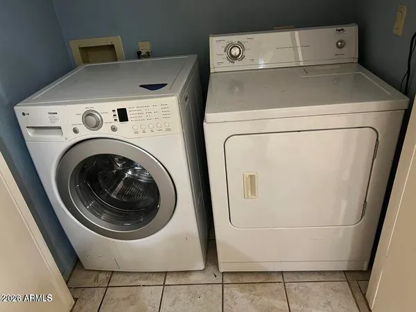 a utility room with dryer and washer