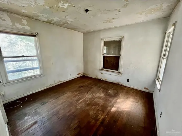 an aerial view of a house with yard swimming pool and outdoor seating