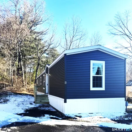 a front view of a house with garage