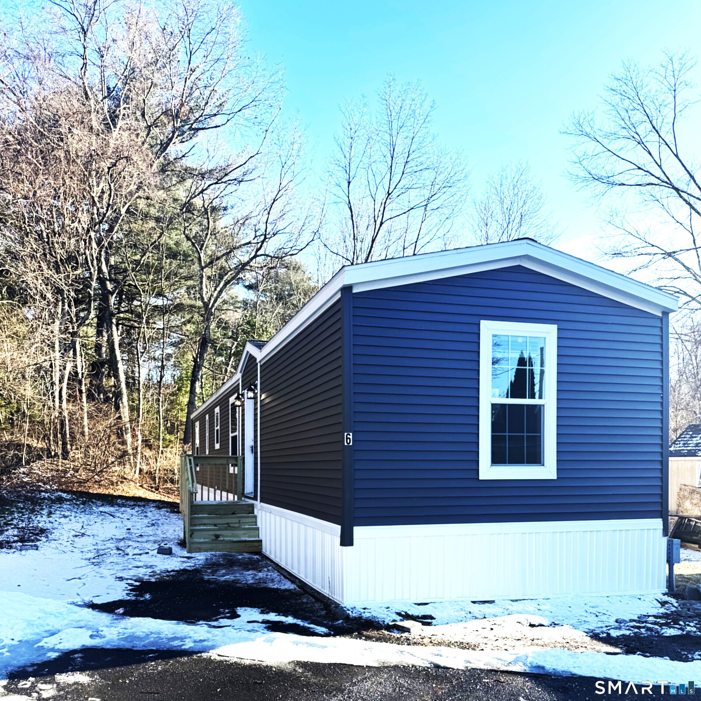 a front view of a house with garage