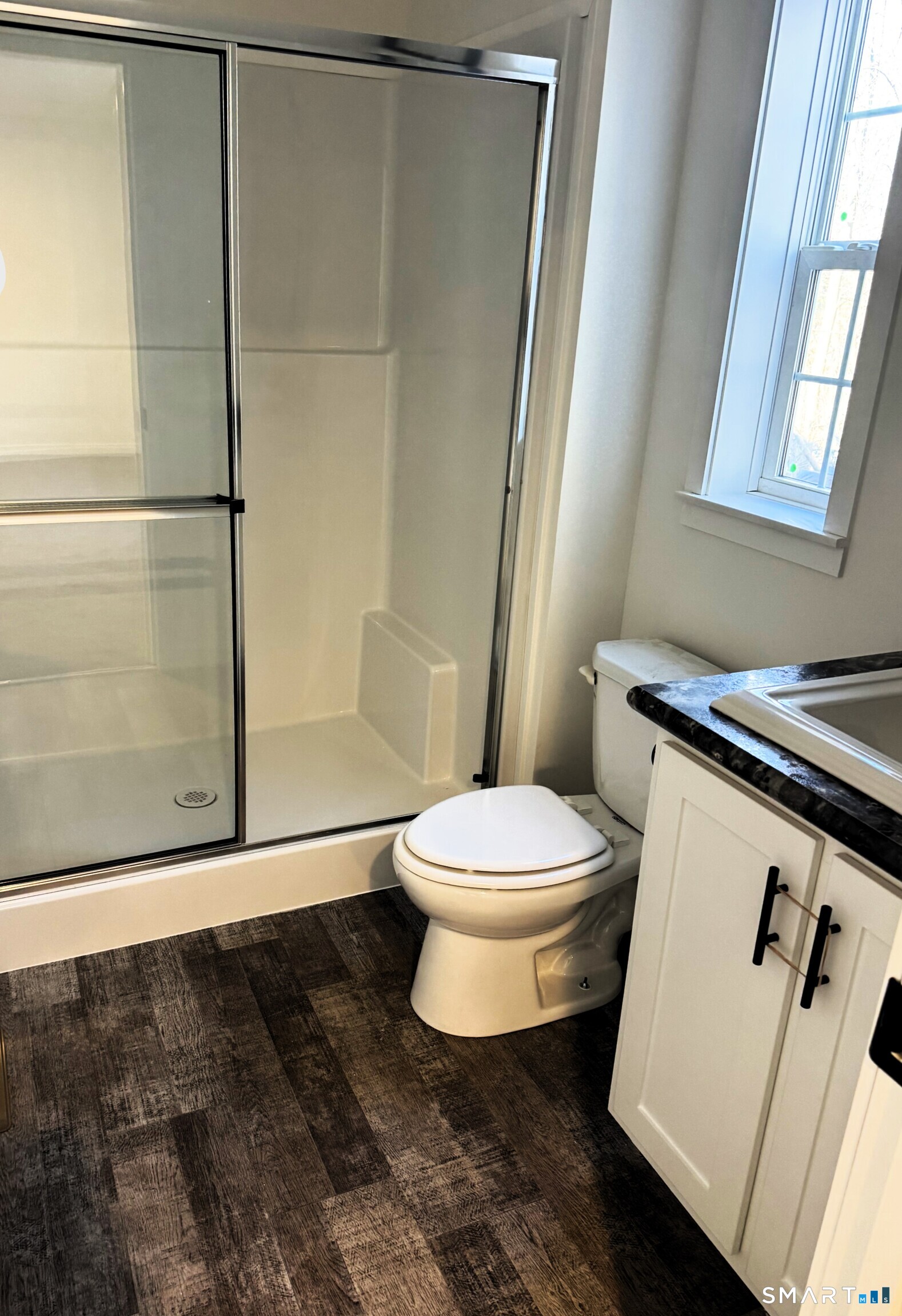 301 South Main Street Newtown, CT 06470 - Photo 11 of 17 a bathroom with a toilet and a shower