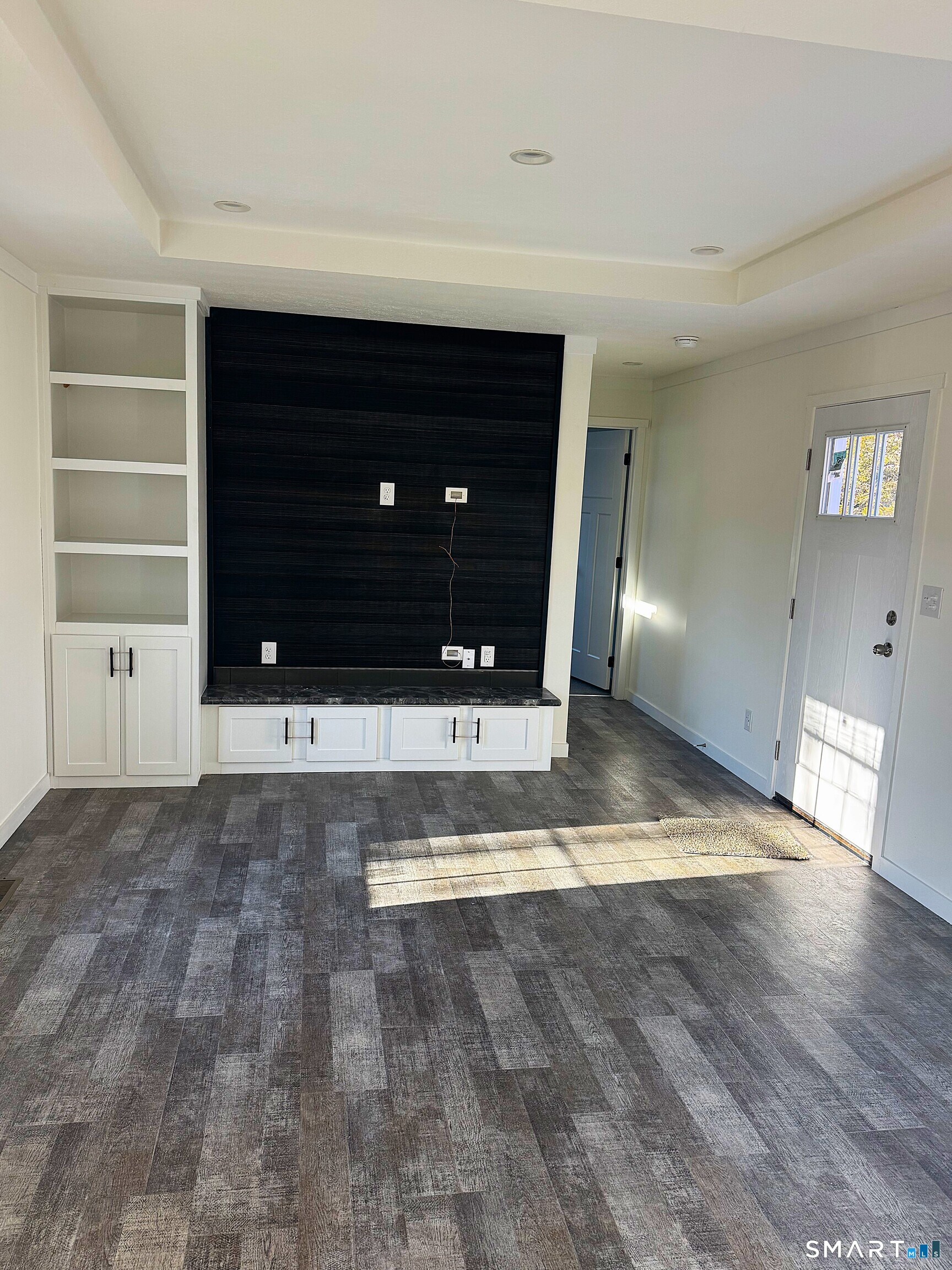 301 South Main Street Newtown, CT 06470 - Photo 5 of 17 a view of a hallway with wooden floor and cabinet