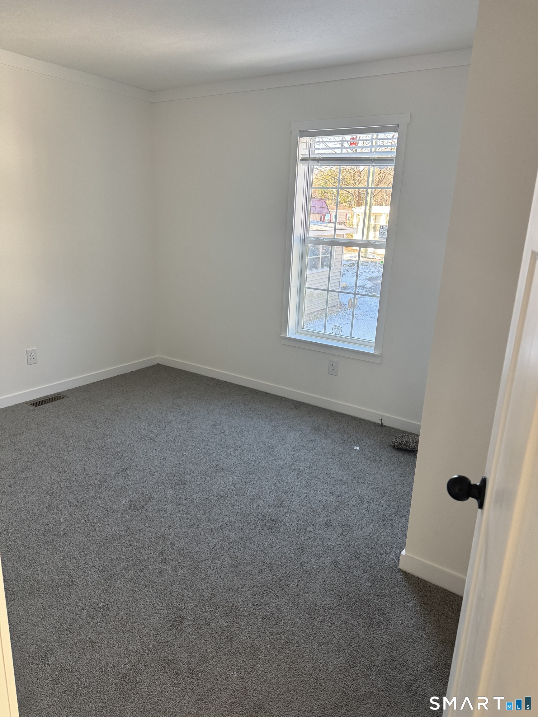 301 South Main Street Newtown, CT 06470 - Photo 7 of 17 an empty room with a window