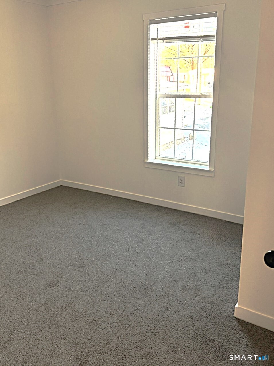 301 South Main Street Newtown, CT 06470 - Photo 8 of 17 an empty room with a window