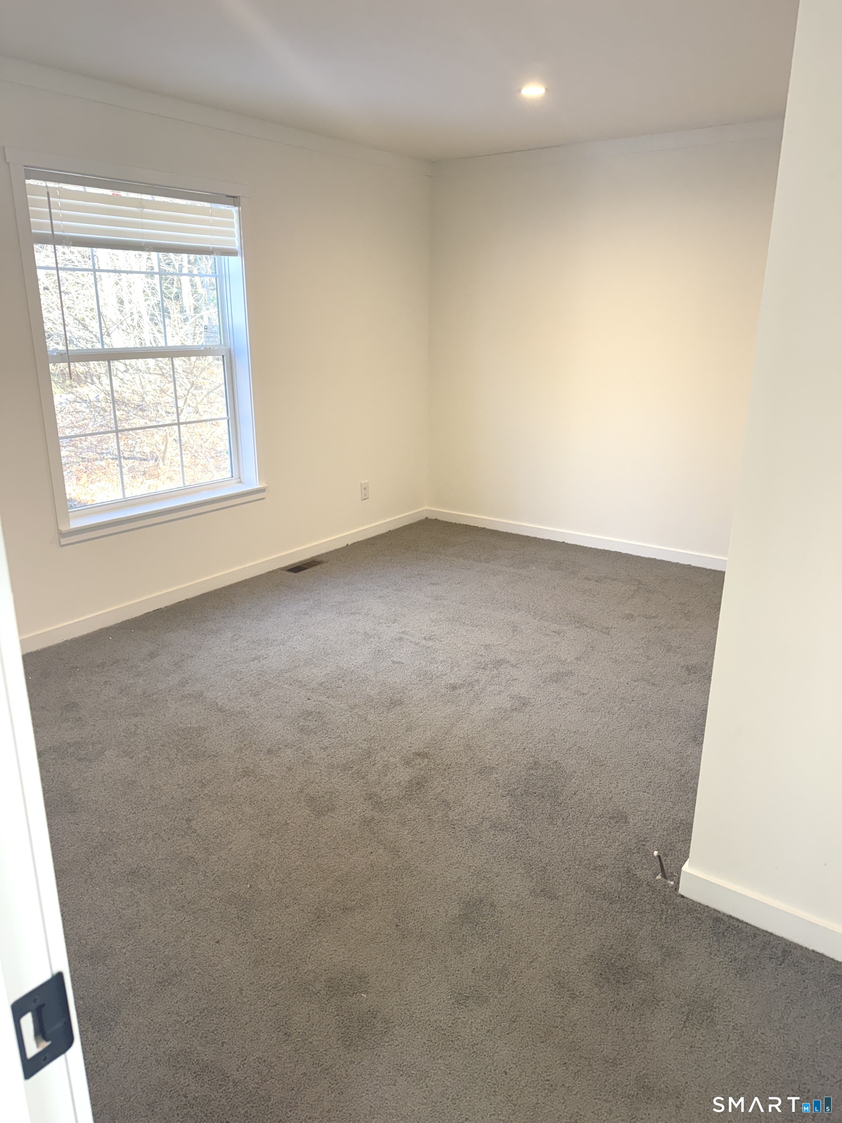 301 South Main Street Newtown, CT 06470 - Photo 9 of 17 an empty room with a window