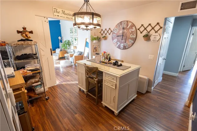a kitchen with wooden floor