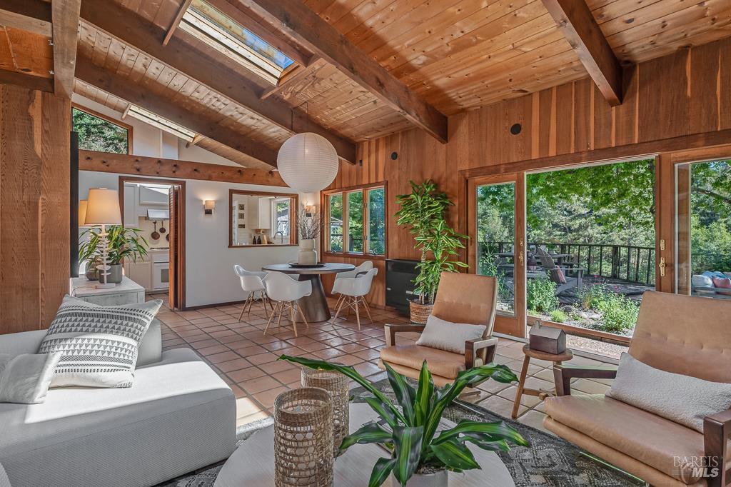15555 Bittner Road Occidental, CA 95465 - Photo 1 of 1 a living room with furniture and a large window