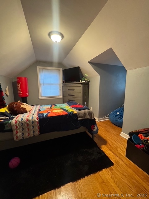 33 Westview Street Hamden, CT 06514 - Photo 9 of 14 a bedroom with furniture and a bed