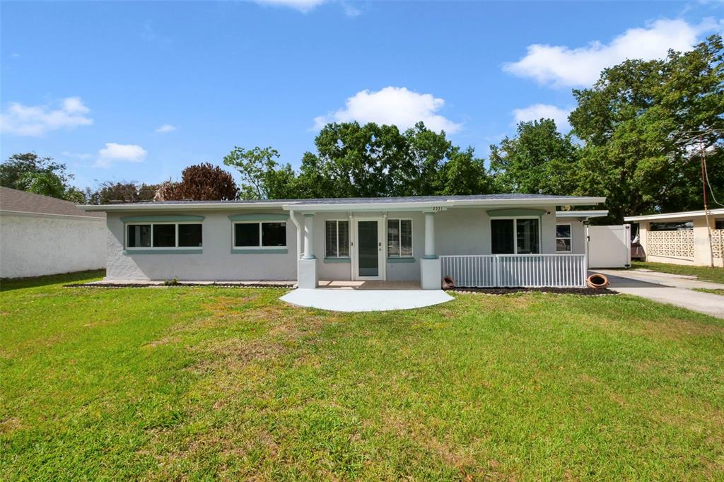 2331 West Oak Street Kissimmee, FL 34741 - Photo 1 of 34 front view of a house with a patio