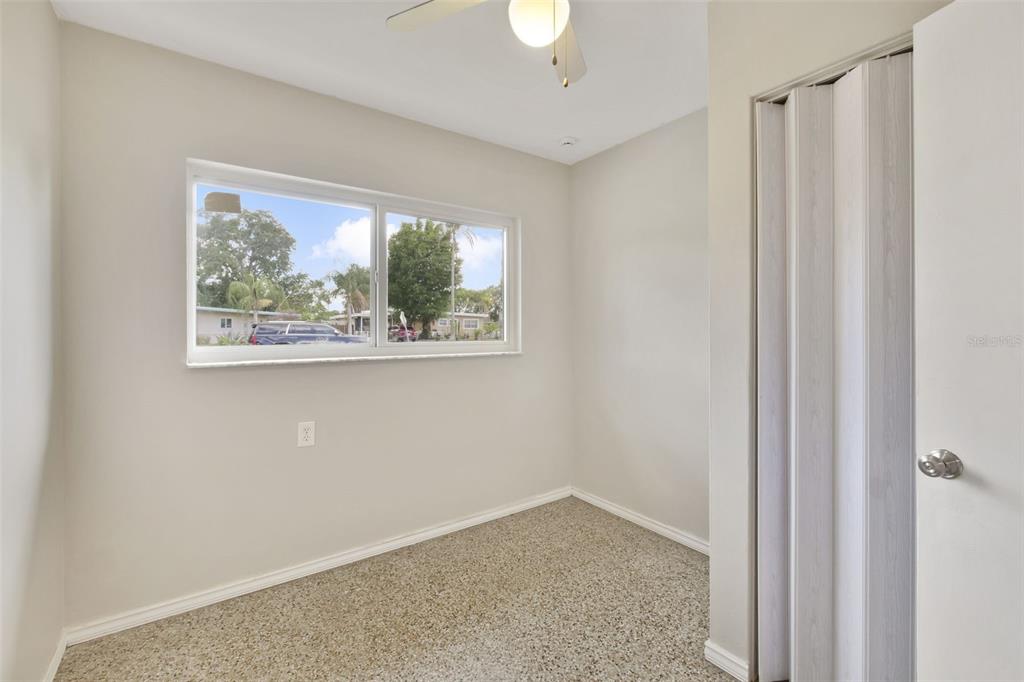 2331 West Oak Street Kissimmee, FL 34741 - Photo 19 of 34 an empty room with a window