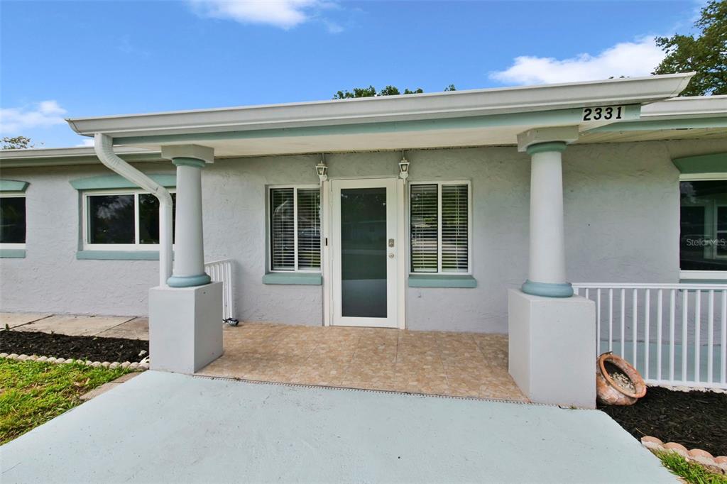 2331 West Oak Street Kissimmee, FL 34741 - Photo 2 of 34 a front view of a house with a yard