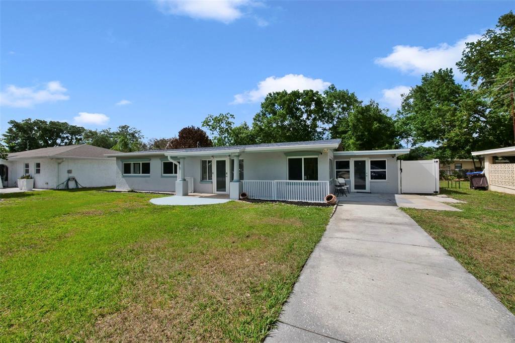 2331 West Oak Street Kissimmee, FL 34741 - Photo 25 of 34 a front view of house with a garden