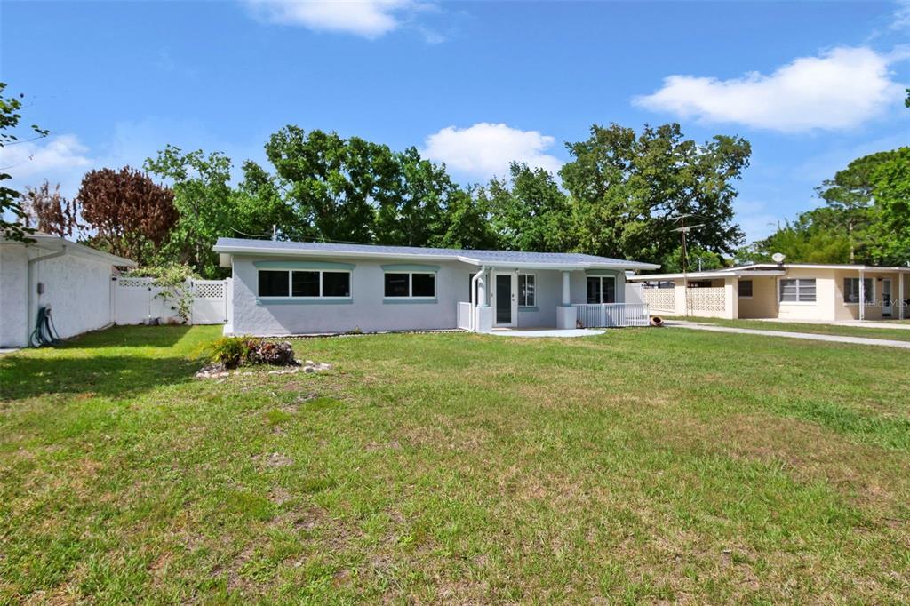 2331 West Oak Street Kissimmee, FL 34741 - Photo 27 of 34 a view of a house with a backyard