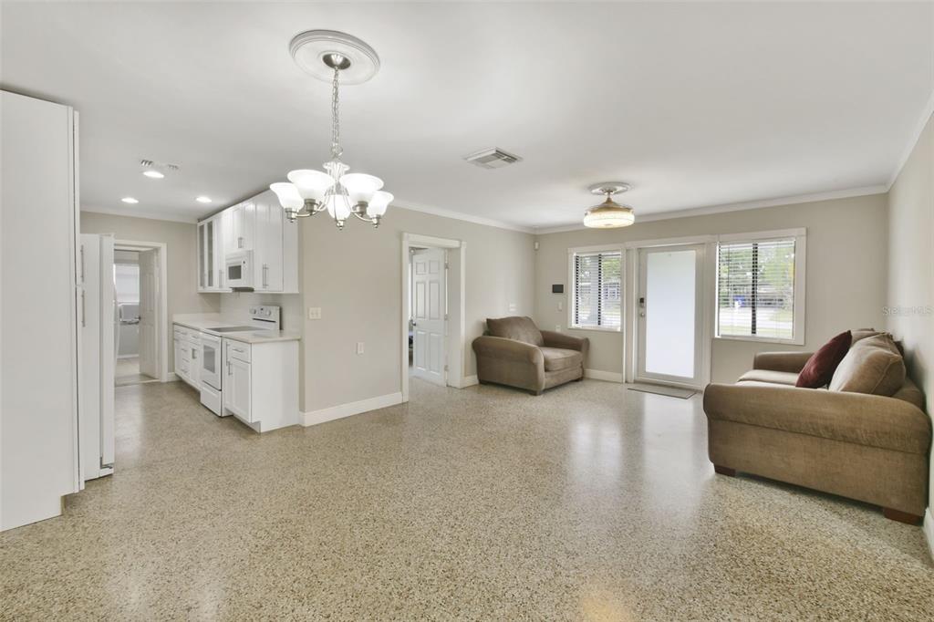 2331 West Oak Street Kissimmee, FL 34741 - Photo 29 of 34 a living room with furniture and a chandelier