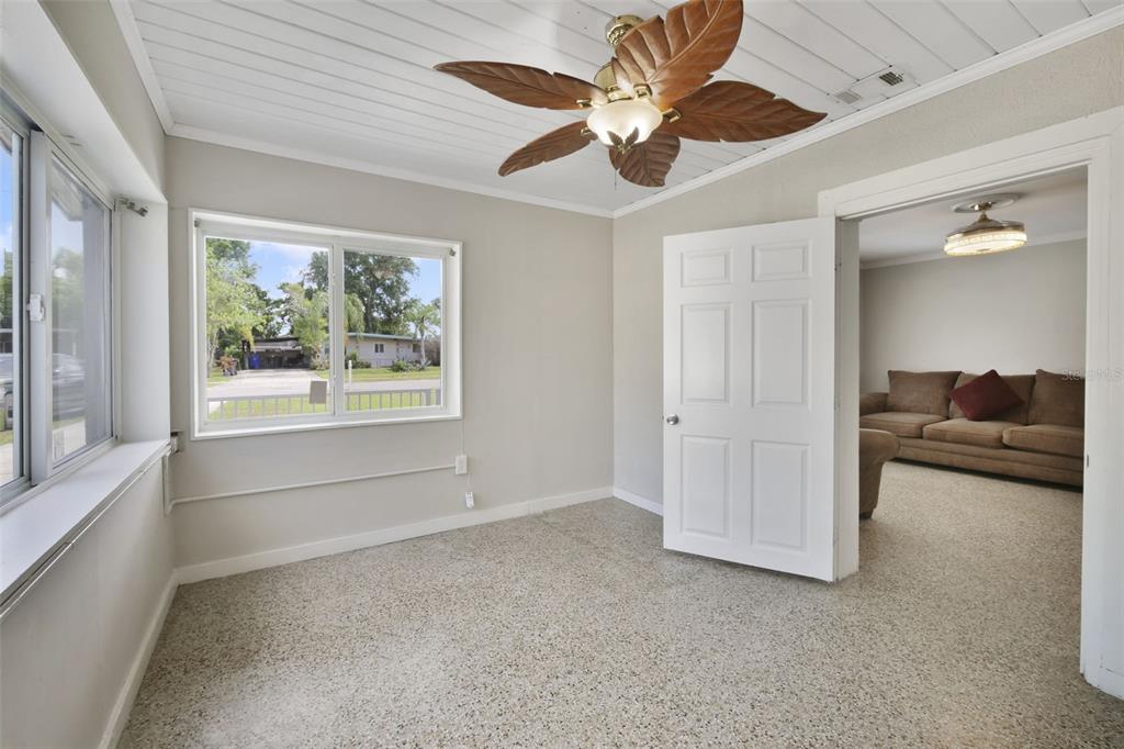 2331 West Oak Street Kissimmee, FL 34741 - Photo 34 of 34 an empty room with windows and ceiling fan