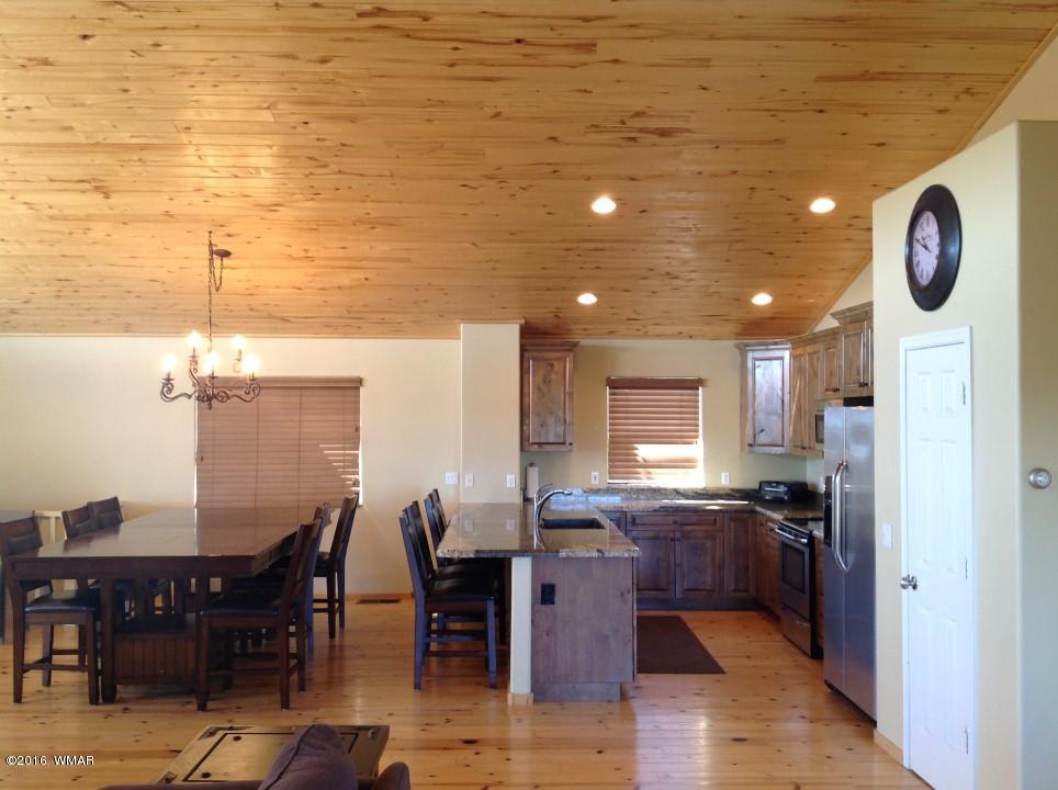2972 Lodgepole Road Overgaard, AZ 85933 - Photo 11 of 41 a open kitchen with lots of counter space and furniture