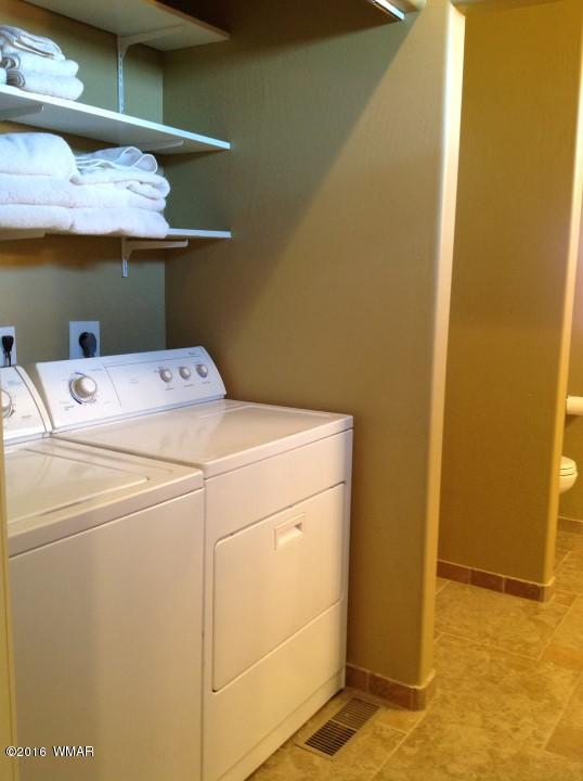 2972 Lodgepole Road Overgaard, AZ 85933 - Photo 16 of 41 a utility room with dryer and washer