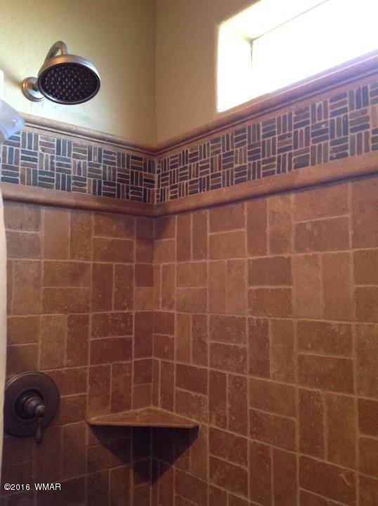 2972 Lodgepole Road Overgaard, AZ 85933 - Photo 17 of 41 a bathroom with a shower