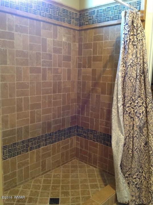 2972 Lodgepole Road Overgaard, AZ 85933 - Photo 20 of 41 a bathroom with a shower