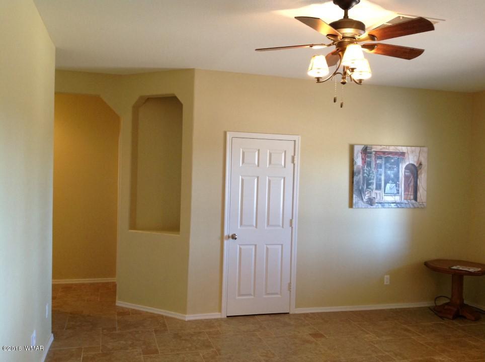 2972 Lodgepole Road Overgaard, AZ 85933 - Photo 28 of 41 a view of a livingroom with a chandelier fan