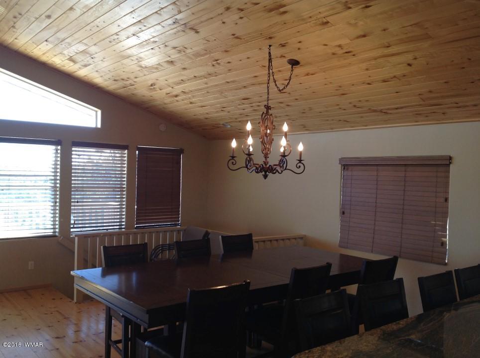 2972 Lodgepole Road Overgaard, AZ 85933 - Photo 4 of 41 a view of a livingroom with furniture and window