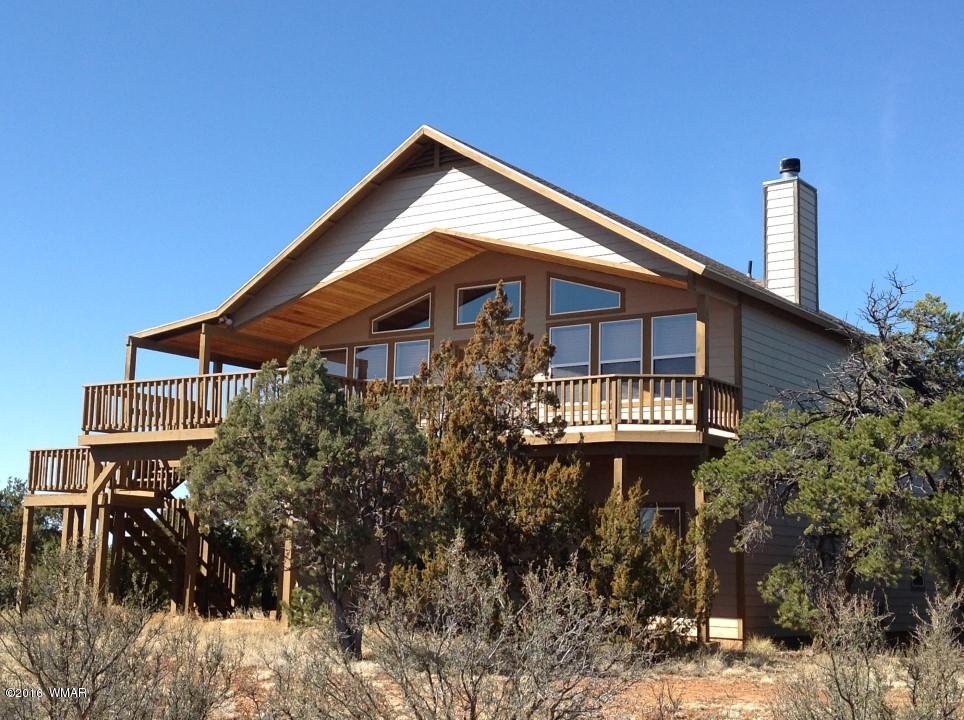 2972 Lodgepole Road Overgaard, AZ 85933 - Photo 41 of 41 a front view of a house with yard and trees