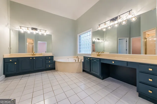 an empty room with closet and a bathroom