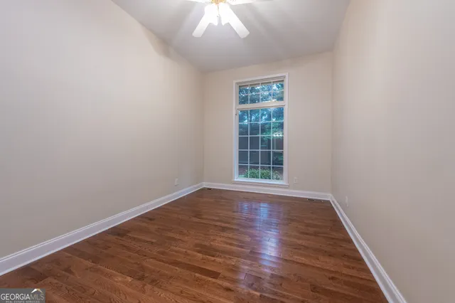 a view of a house with yard and a garden