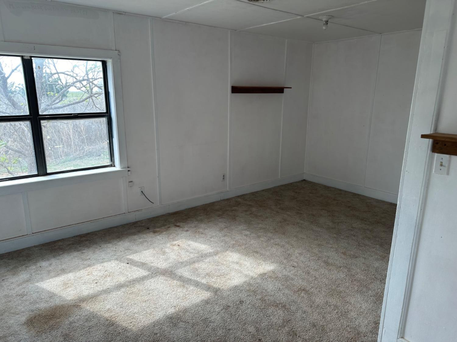 621 County Road 280 Post, TX 79356 - Photo 12 of 17 an empty room with a window