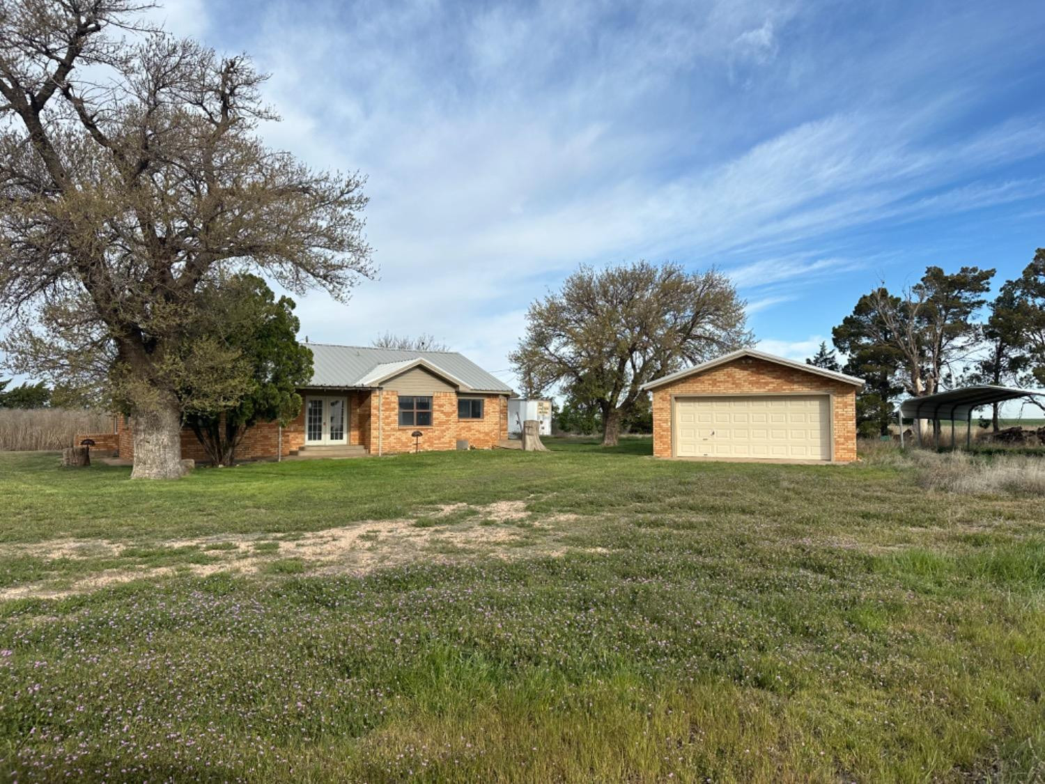 621 County Road 280 Post, TX 79356 - Photo 2 of 17 a front view of a house with a yard