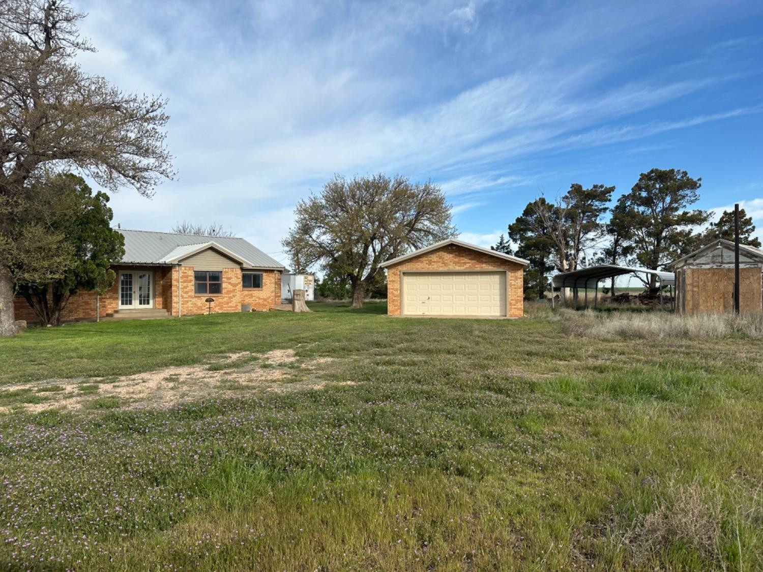 621 County Road 280 Post, TX 79356 - Photo 8 of 17 a view of a house with a yard