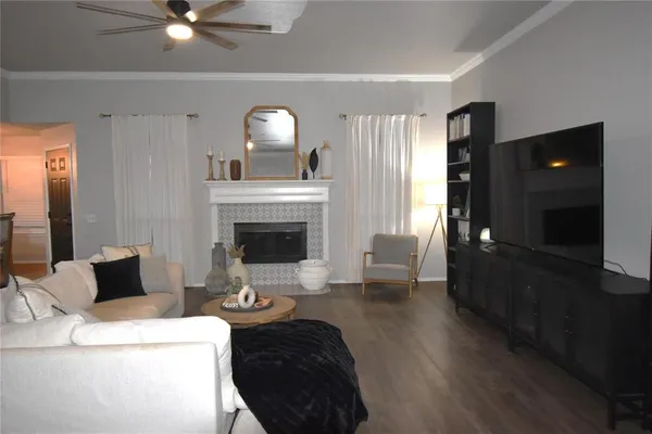 a living room with furniture and a flat screen tv