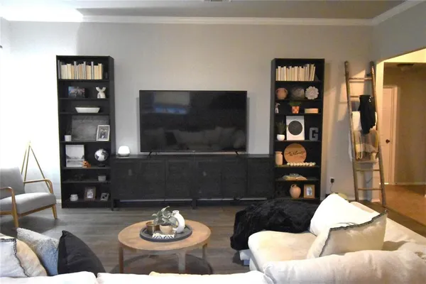 a view of a dining room with furniture and chandelier