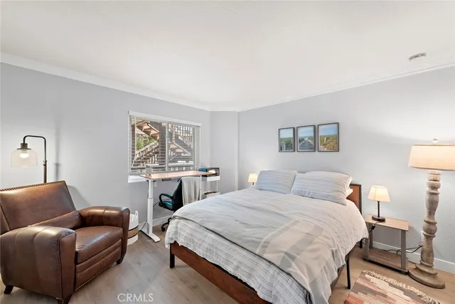 a bedroom with a bed and a couch