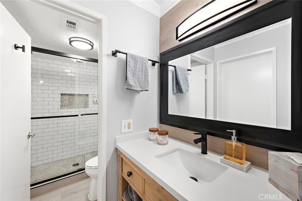 70 Corniche Drive, Unit A Dana Point, CA 92629 - Photo 16 of 27 a bathroom with a sink a toilet and shower