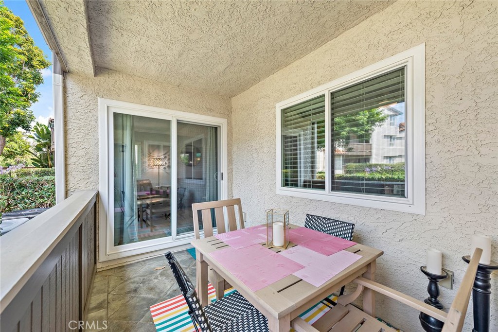 70 Corniche Drive, Unit A Dana Point, CA 92629 - Photo 19 of 27 a patio with a table and chairs
