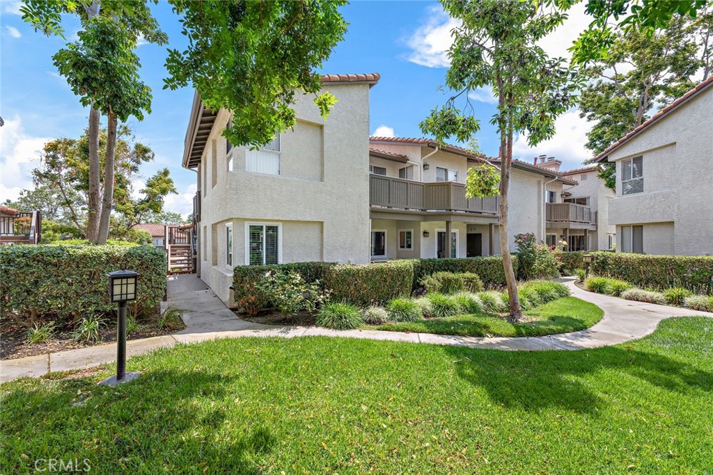 70 Corniche Drive, Unit A Dana Point, CA 92629 - Photo 24 of 27 a front view of a house with a yard