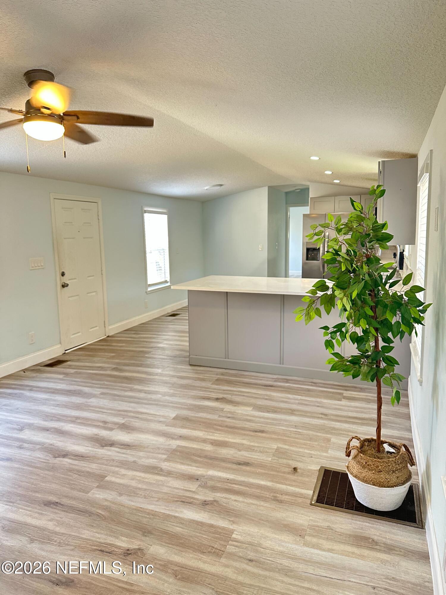 1635 Natalie Road St. Augustine, FL 32084 - Photo 12 of 16 a living room with furniture and a potted plant