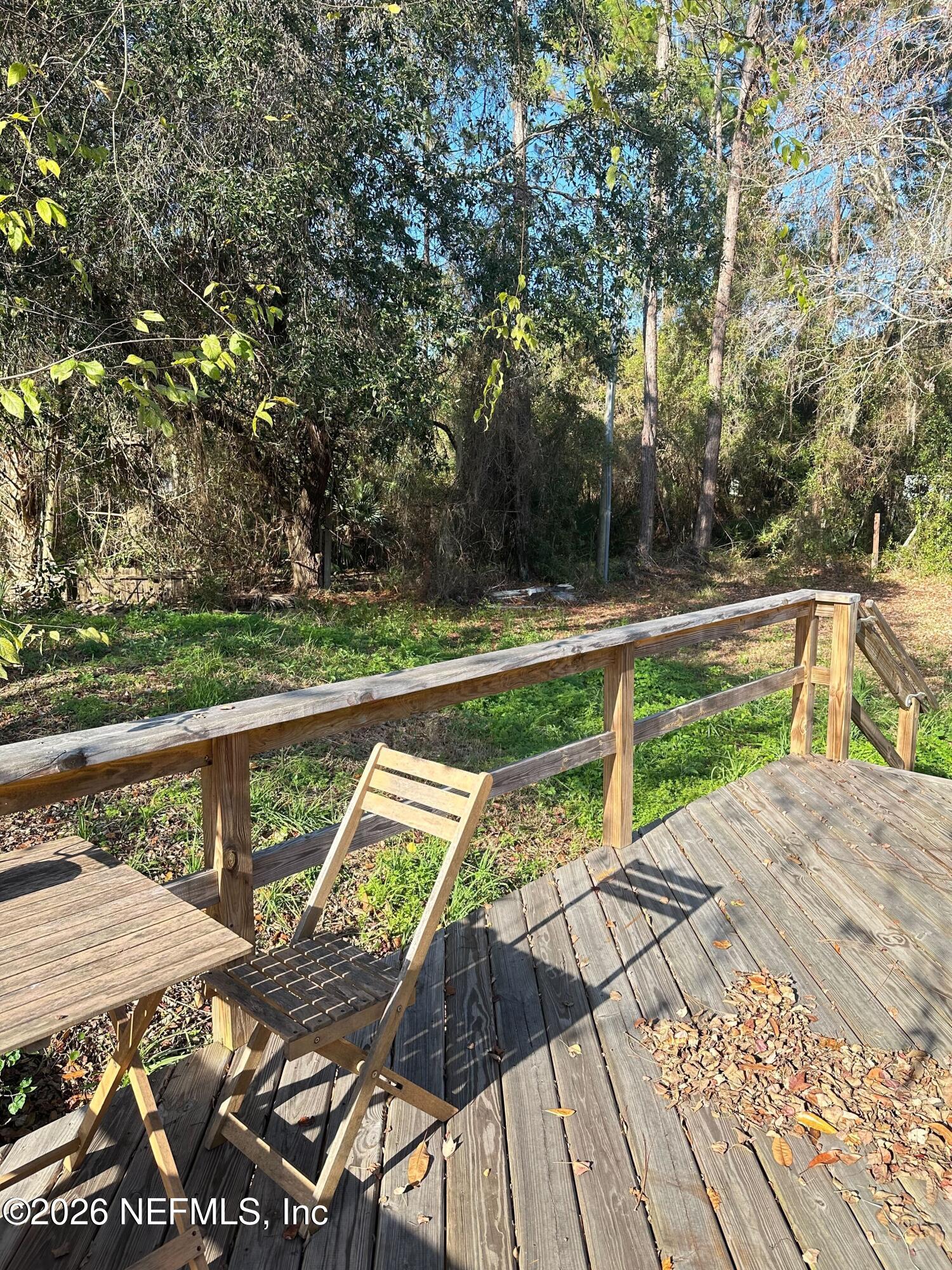 1635 Natalie Road St. Augustine, FL 32084 - Photo 15 of 16 a view of a patio with lawn chairs next to a yard