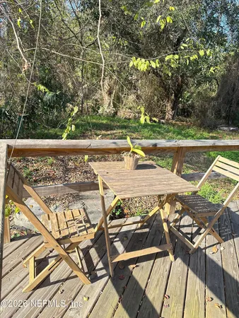 a view of a swimming pool with a patio and a yard
