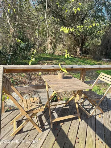 a view of a swimming pool with a patio and a yard
